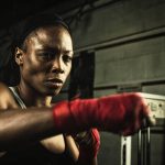 female athlete punching the bag.