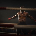 a muscular boxer in a dim ring raises his arms, ready for the fight